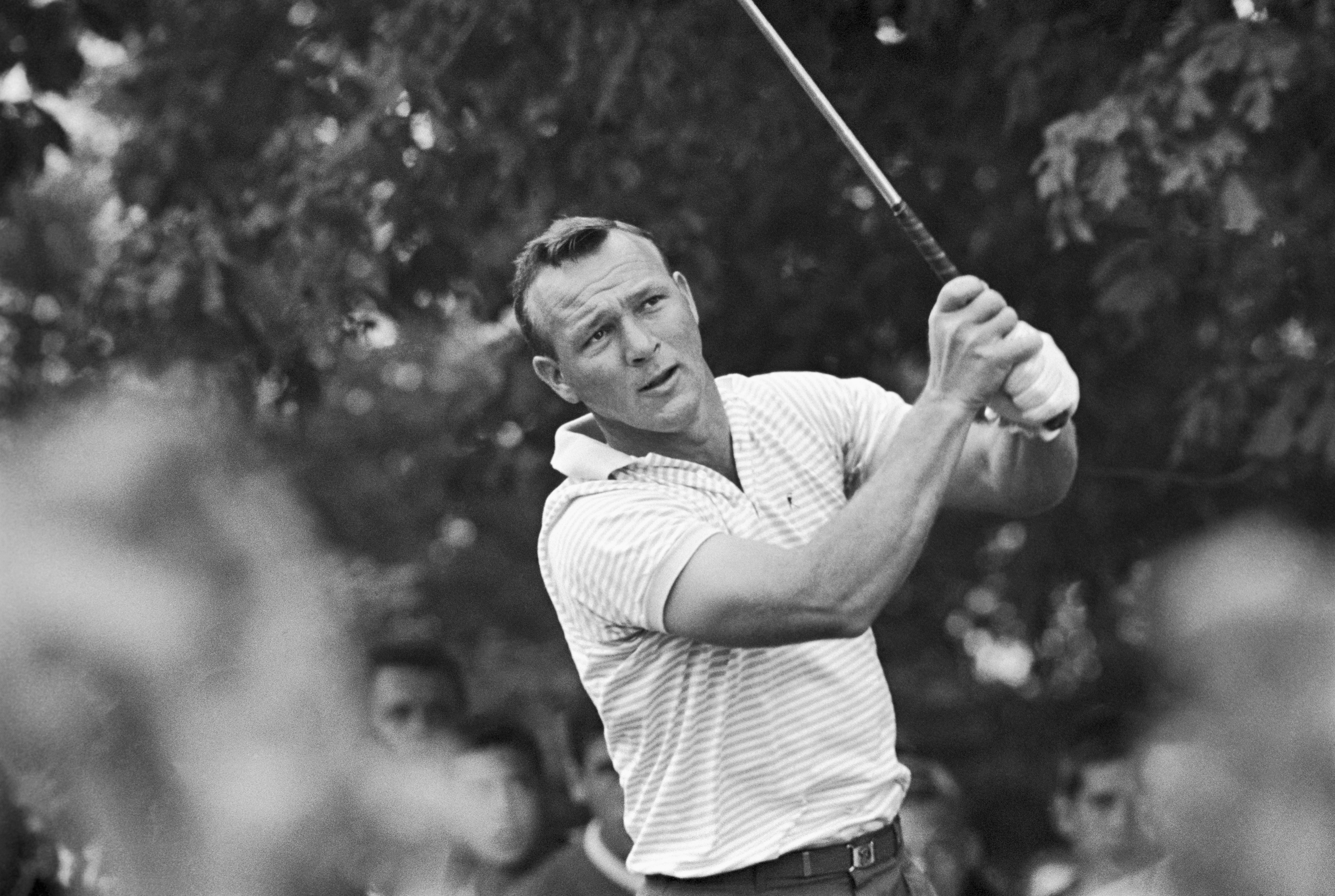 Arnold Palmer tees off on the 10th hole with a good margin of lead over Phil Rodgers and Jacky Cupit.