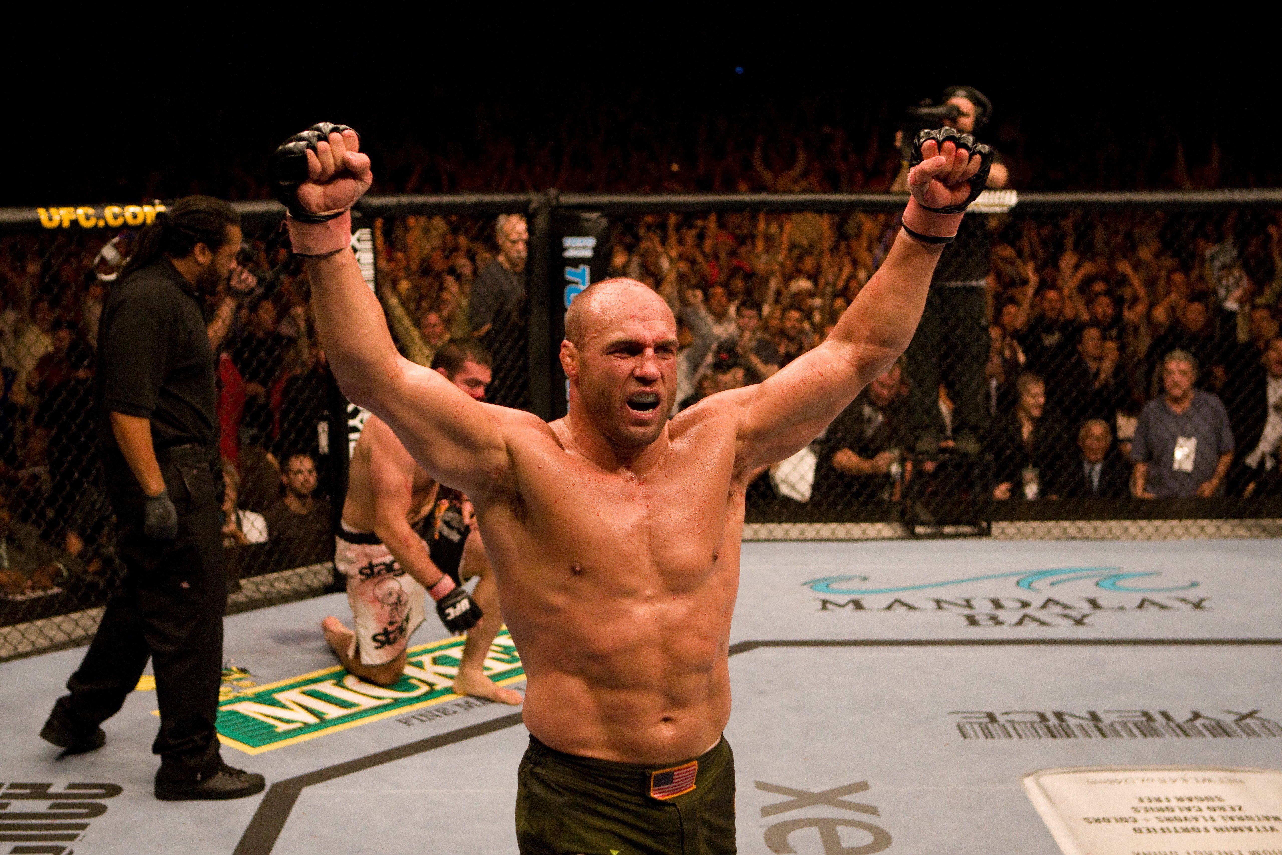 Randy Couture (green shorts) def. Gabriel Gonzaga (black/white shorts)
