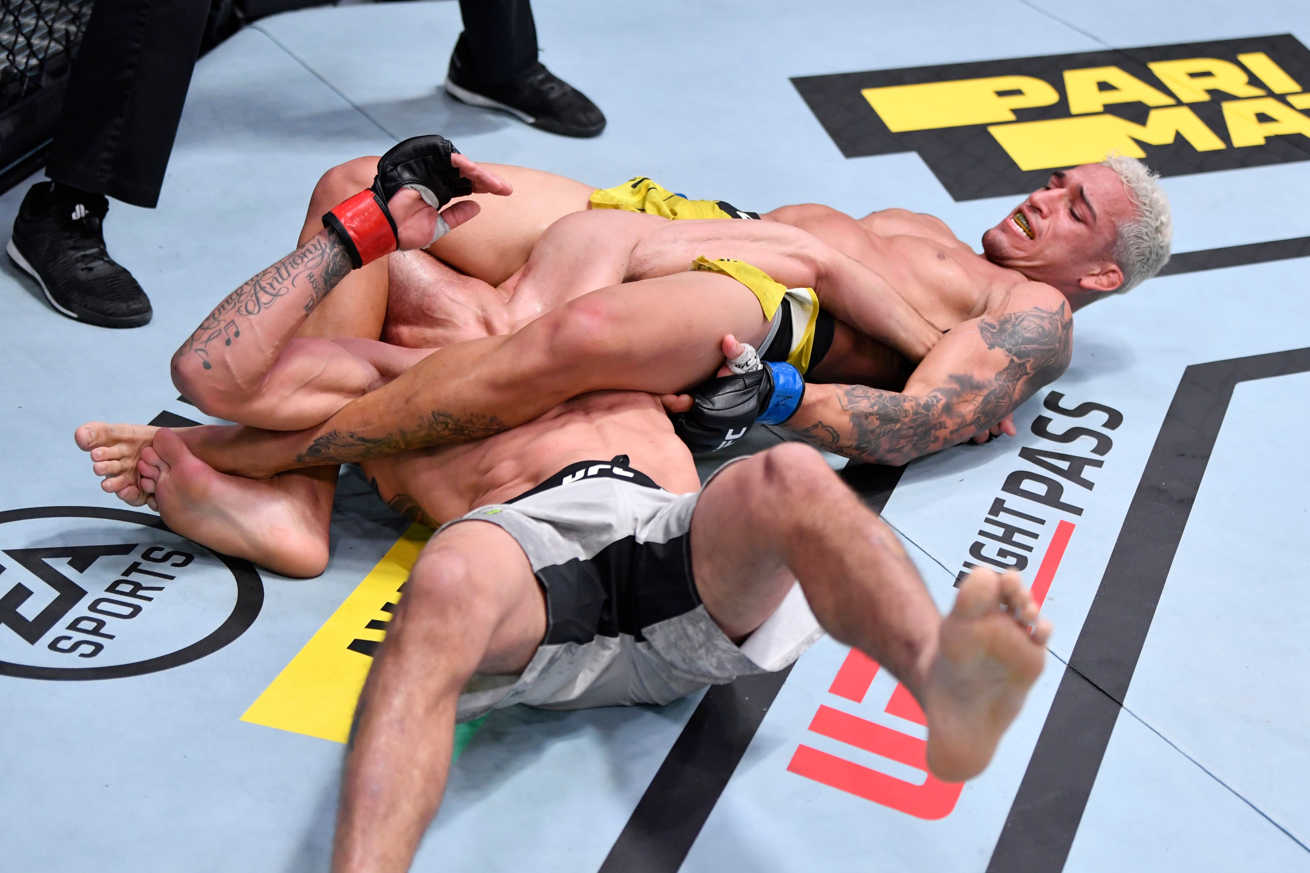 Charles Oliveira of Brazil attempts to submit Tony Ferguson