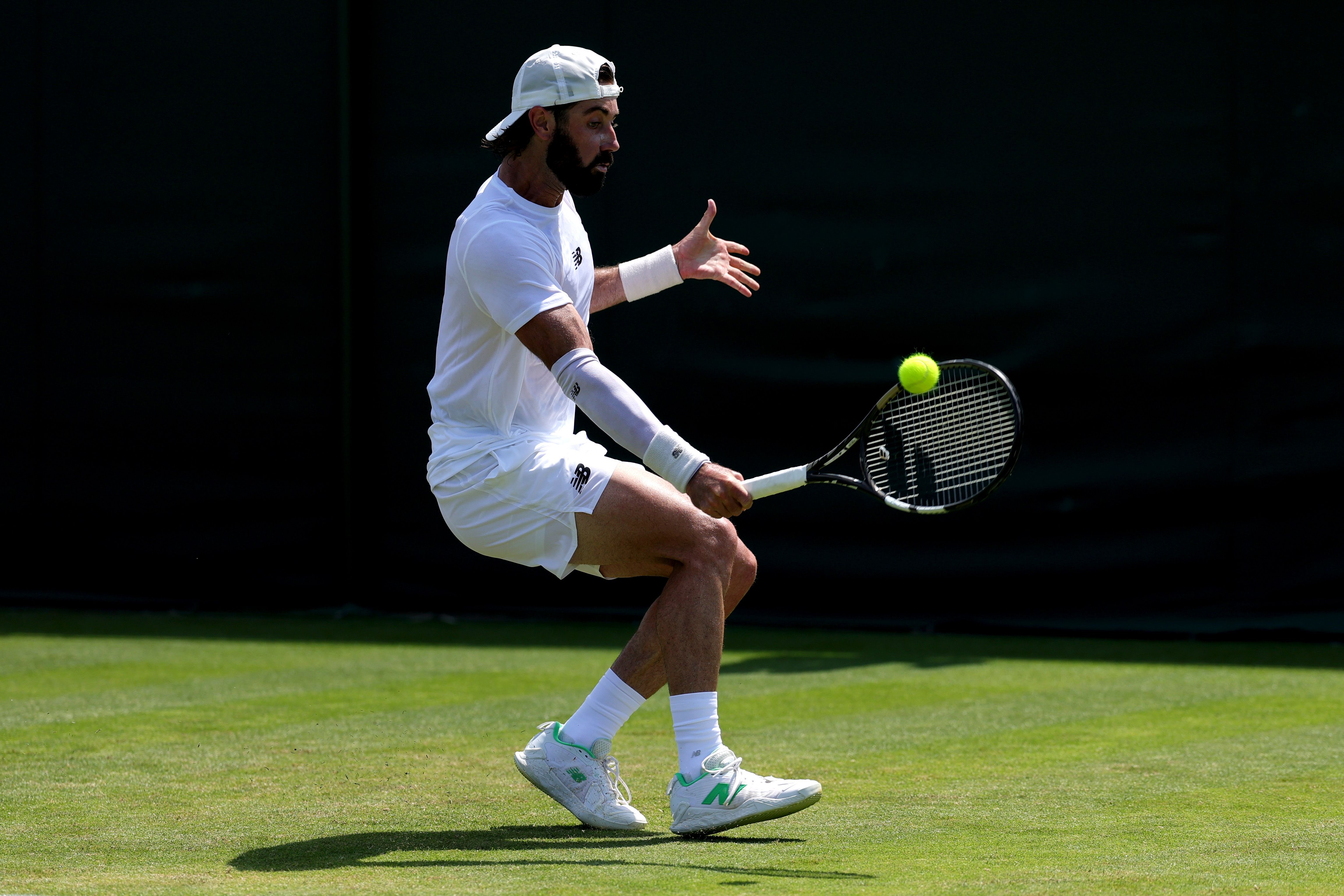 Jordan Thompson of Australia plays a backhand against Vit Kopriva 