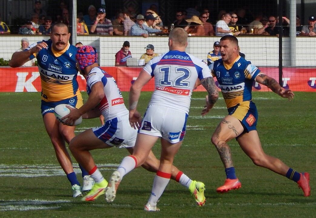 Kalyn Ponga, on the attack, is the highest-paid NRL player.jpg